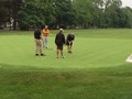 Members show off their golf skills.