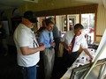 Members and guests look at exhibits of mining artifacts with items from the collections of John Podgurski, Reading Anthracite, Eckley Miners Village, the Scranton Anthracite Museum, F. Charles Petrillo, and Mike Korb; and a table publicizing the 2015 Field Conference of PA Geologists.