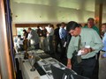 Members and guests look at exhibits of mining artifacts with items from the collections of John Podgurski, Reading Anthracite, Eckley Miners Village, the Scranton Anthracite Museum, F. Charles Petrillo, and Mike Korb; and a table publicizing the 2015 Field Conference of PA Geologists.